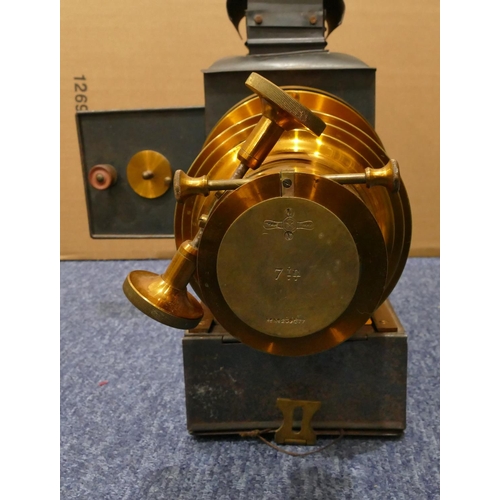 857 - A metal magic lantern, 49cm long