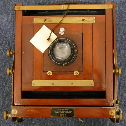 870 - Kodak mahogany and brass folding plate camera with some accessories