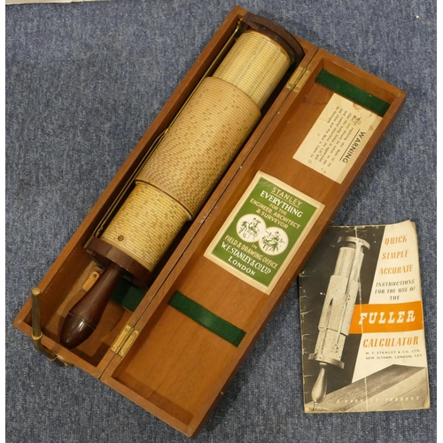 876 - A 1947 Stanley Fuller Type 2 spiral slide rule calculator in fitted mahogany box with instructions