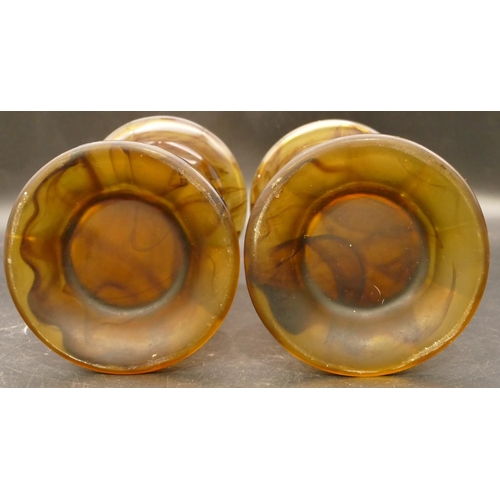 88 - A pair of Art Deco amber cloud glass column vases by Davidson on sweeping bases, 20.5cm high (2)