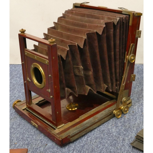 893 - A Thornton Pickard folding mahogany plate camera with leather case (case in need of restoration)