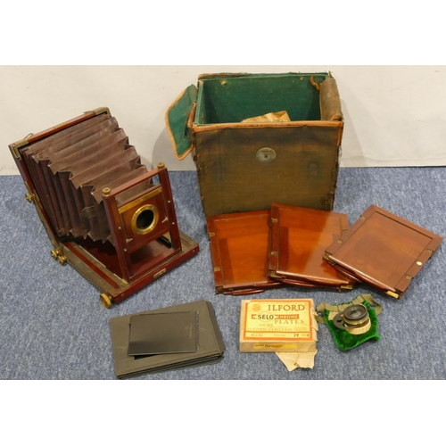 893 - A Thornton Pickard folding mahogany plate camera with leather case (case in need of restoration)