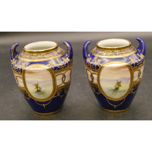 91 - A pair of Noritake small round bulbous thin necked 2-handled vases on royal blue ground with hand pa... 