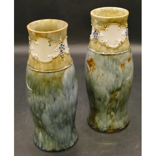 93 - A pair of Royal Doulton glazed earthenware round bulbous thin necked trumpet shaped vases on blue an... 