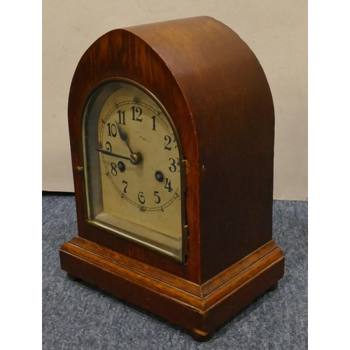 938 - Camerer Cuss & Co. oak 8-day striking mantel clock with silvered arched dial with Arabic numerals on... 