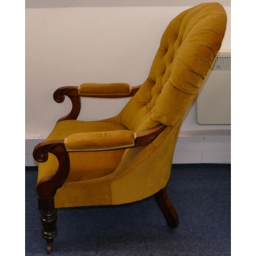 946 - A 19th Century mahogany spoon back armchair with velvet overstuffed seat, button back and padded arm... 