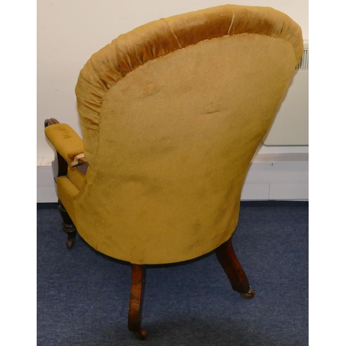 946 - A 19th Century mahogany spoon back armchair with velvet overstuffed seat, button back and padded arm... 