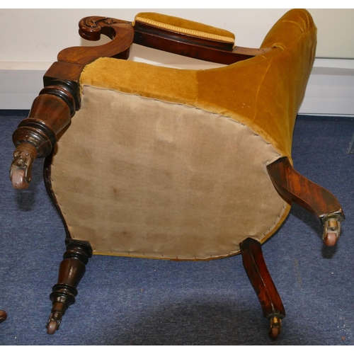 946 - A 19th Century mahogany spoon back armchair with velvet overstuffed seat, button back and padded arm... 