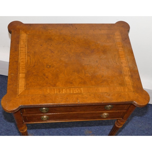 948 - A good quality reproduction walnut side table with banded decoration, 2 drawers, on turned fluted le... 