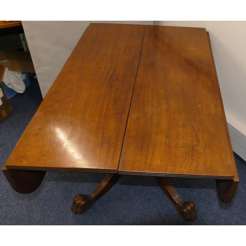 952 - A 19th Century mahogany drop leaf dining table on centre column support with 4 splayed reeded legs w... 