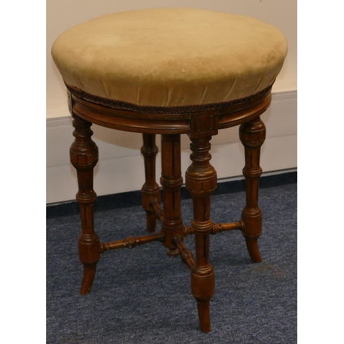 955 - A walnut round piano stool with swivel cream velvet overstuffed seat on turned fluted legs, 37.5cm d... 