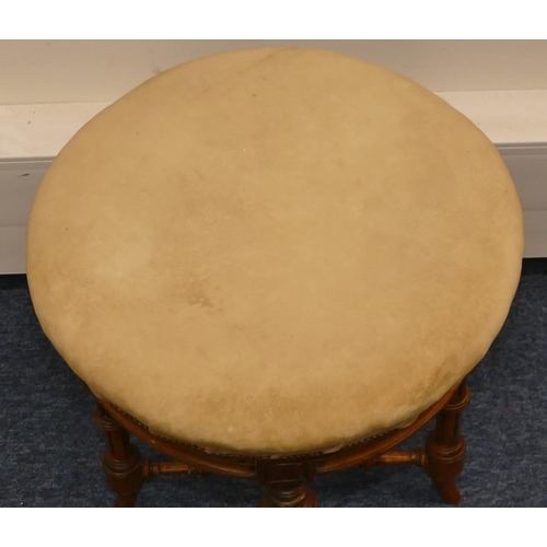 955 - A walnut round piano stool with swivel cream velvet overstuffed seat on turned fluted legs, 37.5cm d... 