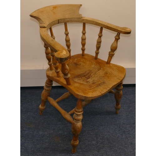 956 - An elm Captain's chair with spindle back, solid seat on round turned legs