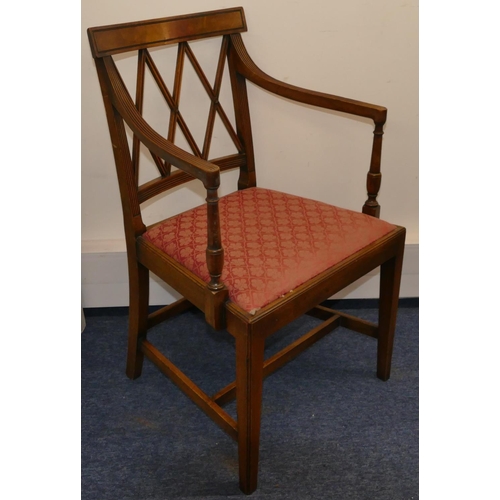 957 - A mahogany carving chair with X shaped back, reeded arms, cream dropping seat on square tapering leg... 