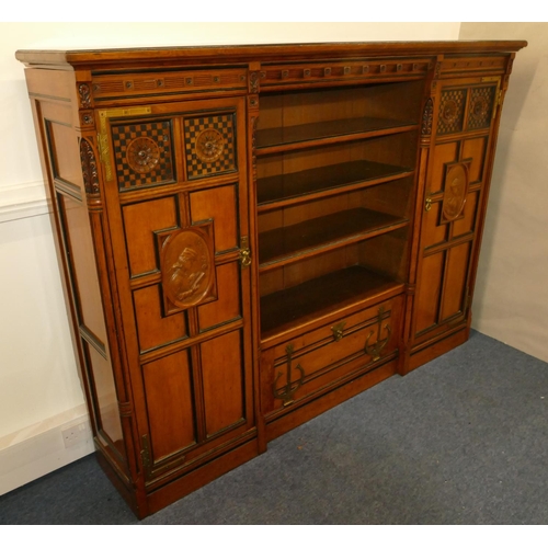 969 - Marsh & Jones Late Kendell & Co Aesthetic Movement oak and ebony low bookcase with allover carved fl... 