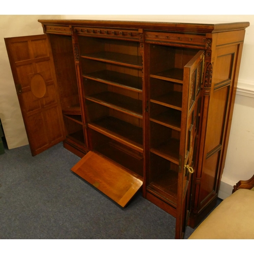 969 - Marsh & Jones Late Kendell & Co Aesthetic Movement oak and ebony low bookcase with allover carved fl... 