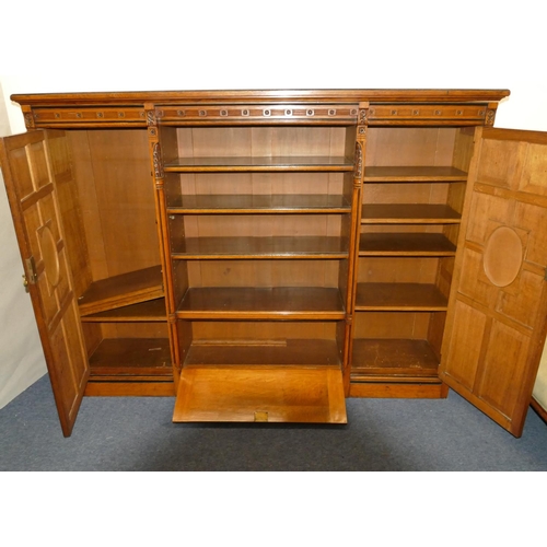 969 - Marsh & Jones Late Kendell & Co Aesthetic Movement oak and ebony low bookcase with allover carved fl... 