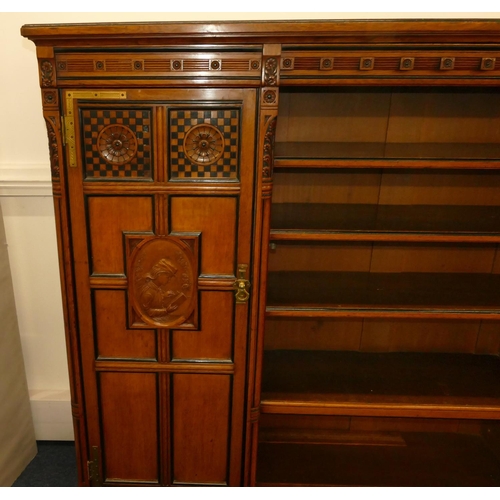 969 - Marsh & Jones Late Kendell & Co Aesthetic Movement oak and ebony low bookcase with allover carved fl... 