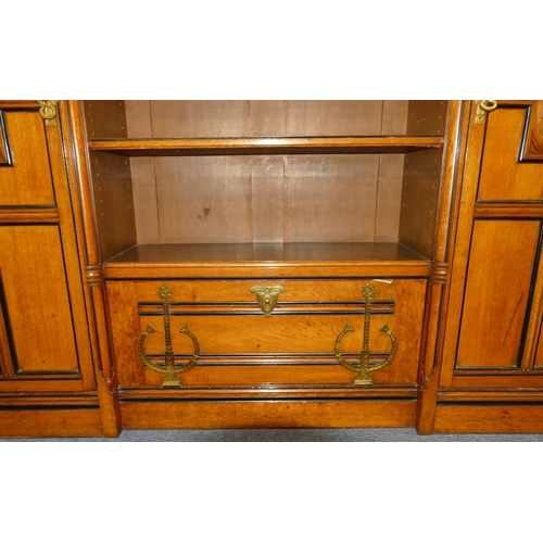 969 - Marsh & Jones Late Kendell & Co Aesthetic Movement oak and ebony low bookcase with allover carved fl... 