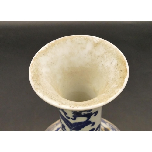 97 - An Oriental blue and white round bulbous thin necked trumpet shaped vase with figure and landscape d... 