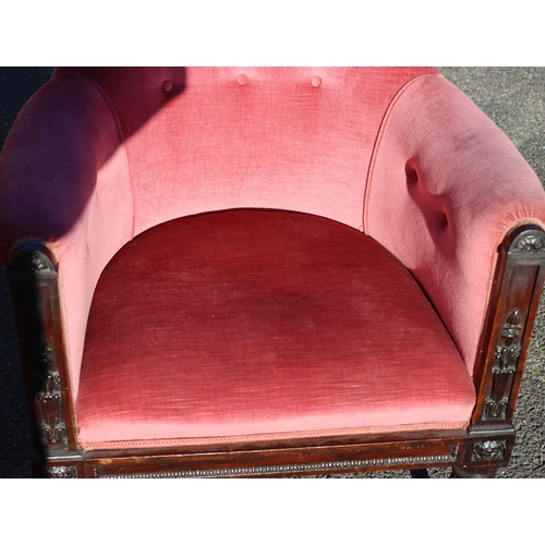 975 - A 19th Century mahogany tub chair with pink velvet overstuffed seat, button back and arms, raised ca... 