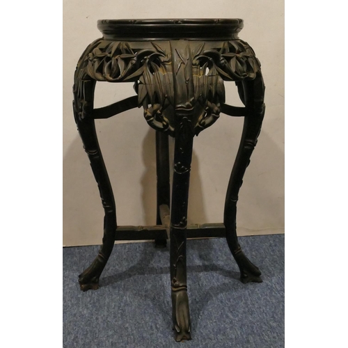 982 - An Oriental hardwood round bulbous shaped jardinière stand with marble top, carved and pierced friez... 