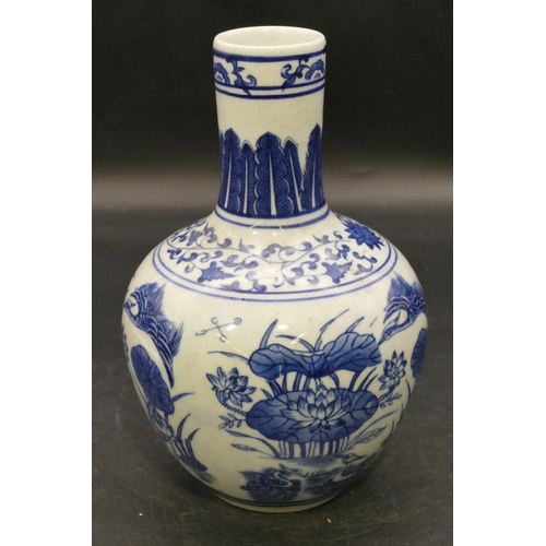 99 - An Oriental round bulbous thin necked blue and white vase with bird, lily and floral decoration, 22c... 