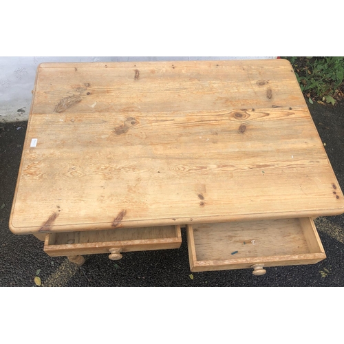 8001 - A pine rectangular kitchen table with 2 drawers, knob handles on round turned legs, 123cm wide, 82cm... 