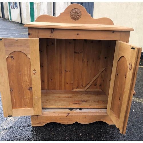 8020 - A pine low cupboard with 2 panel doors, wood knob handles, 76cm wide, 42cm deep, 82cm high. This Lot... 