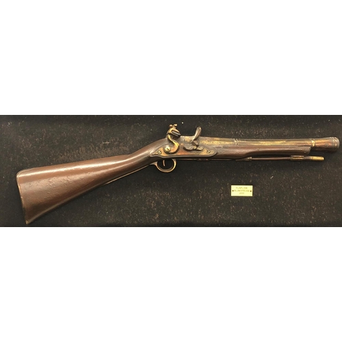 8050 - A framed reproduction flintlock blunderbuss 1777, frame 94cm x 38cm.