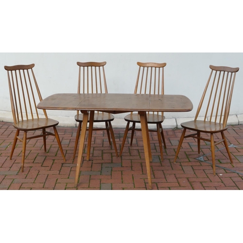 8071 - An Ercol elm dining suite with drop leaf table, 73cm deep, 138.5cm wide, 71cm high and 4 stick back ... 