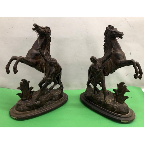 8084 - 2 spelter Marley horses on wood stands 43cm high overall