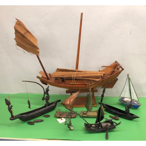 8095 - A wooden model of a Junk boat on stand, 2 model brass sailing rafts and 4 other model boats.