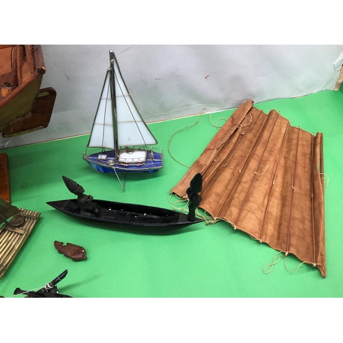 8095 - A wooden model of a Junk boat on stand, 2 model brass sailing rafts and 4 other model boats.