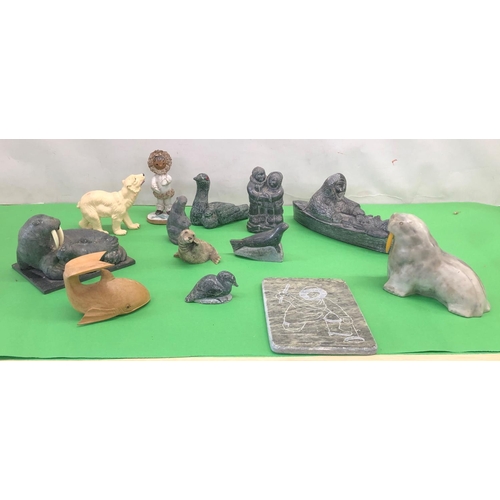 8101 - A quantity of soapstone Eskimo art figures, a plaque depicting an Eskimo fishing and various other f... 