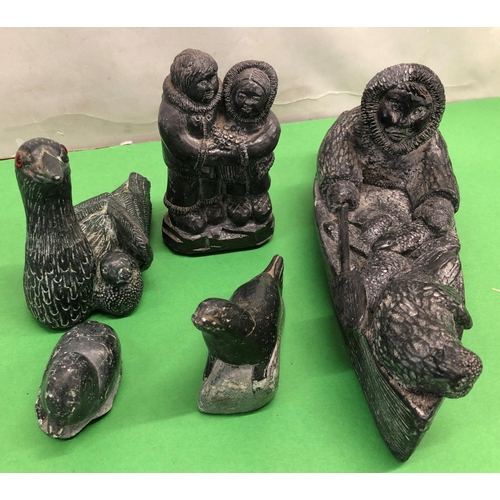 8101 - A quantity of soapstone Eskimo art figures, a plaque depicting an Eskimo fishing and various other f... 