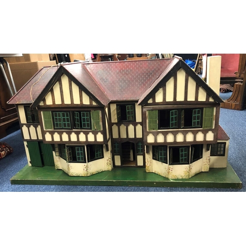 8105 - Vintage Triang Brothers  c1930's dolls house with metal framed windows, twin gabled roof and red til... 