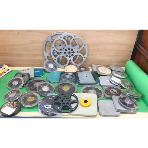 8115 - A quantity of cine reels and film.