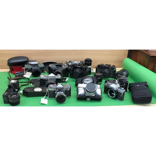 8120 - A quantity of cameras including Canon A-1, Canon F-1, Praktoka, Nikon FE, Edixa Reflex-D, Exaktra  R... 