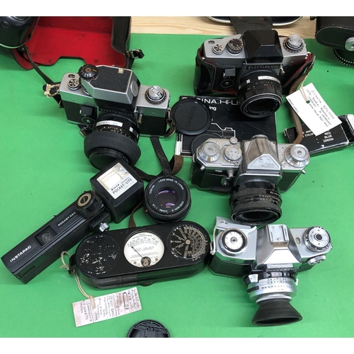 8120 - A quantity of cameras including Canon A-1, Canon F-1, Praktoka, Nikon FE, Edixa Reflex-D, Exaktra  R... 