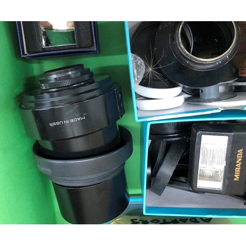 8131 - A mixed quantity of camera developing equipment, liquid measures, lens caps, lenses including USSR 8... 