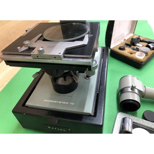 8133 - A Watson Microsystem 70 microscope with carrying box and a box with additional lenses.