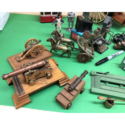 8136 - A mixed quantity of model carriages, ski lift, model soldiers, novelty pencil sharpeners etc.