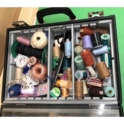 8142 - A quantity of sewing materials, threads, needles etc in hard carrying case.