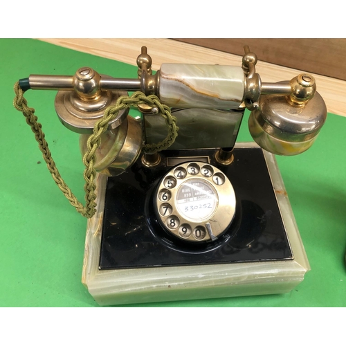 8143 - An onyx desk telephone and a Swedish Fyns Kommunale Telefonskab Fragonard TYPENT13 telephone. (2)