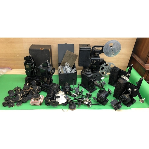 8145 - 2 Baby projectors and a quantity of related parts, transformer, resistor and film reels etc.