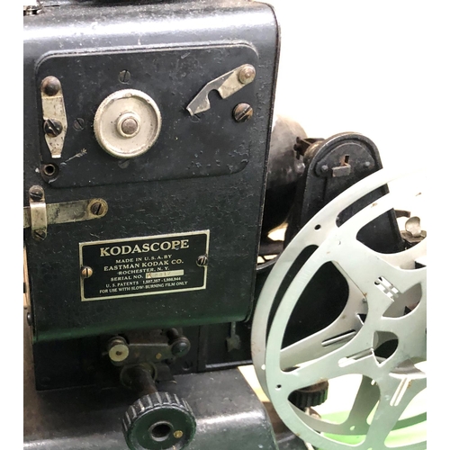 8145 - 2 Baby projectors and a quantity of related parts, transformer, resistor and film reels etc.