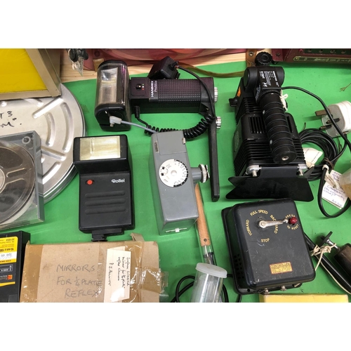 8149 - A mixed quantity of camera/film accessories, cine films, manuals, lights etc.