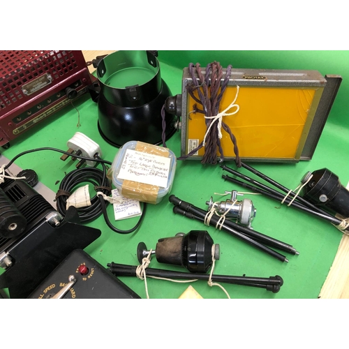 8149 - A mixed quantity of camera/film accessories, cine films, manuals, lights etc.