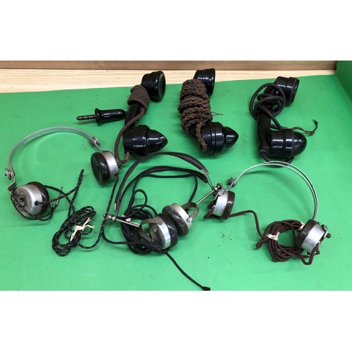 8159 - Various vintage telephone handsets and headphones.